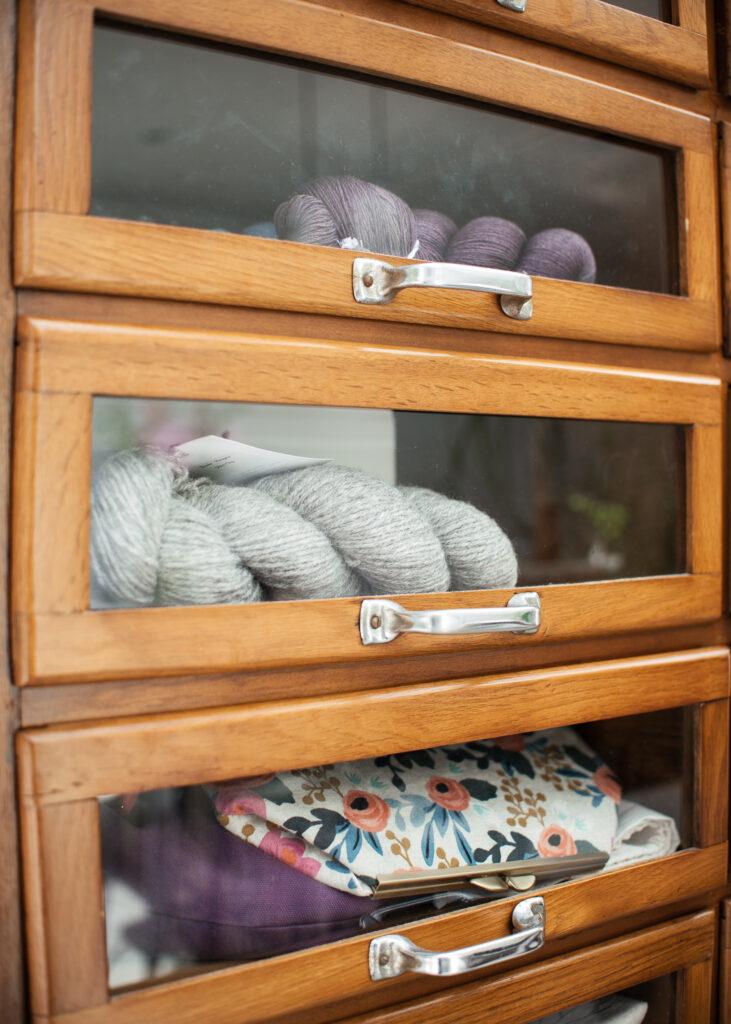 A haberdashery cupboard filled with yarn