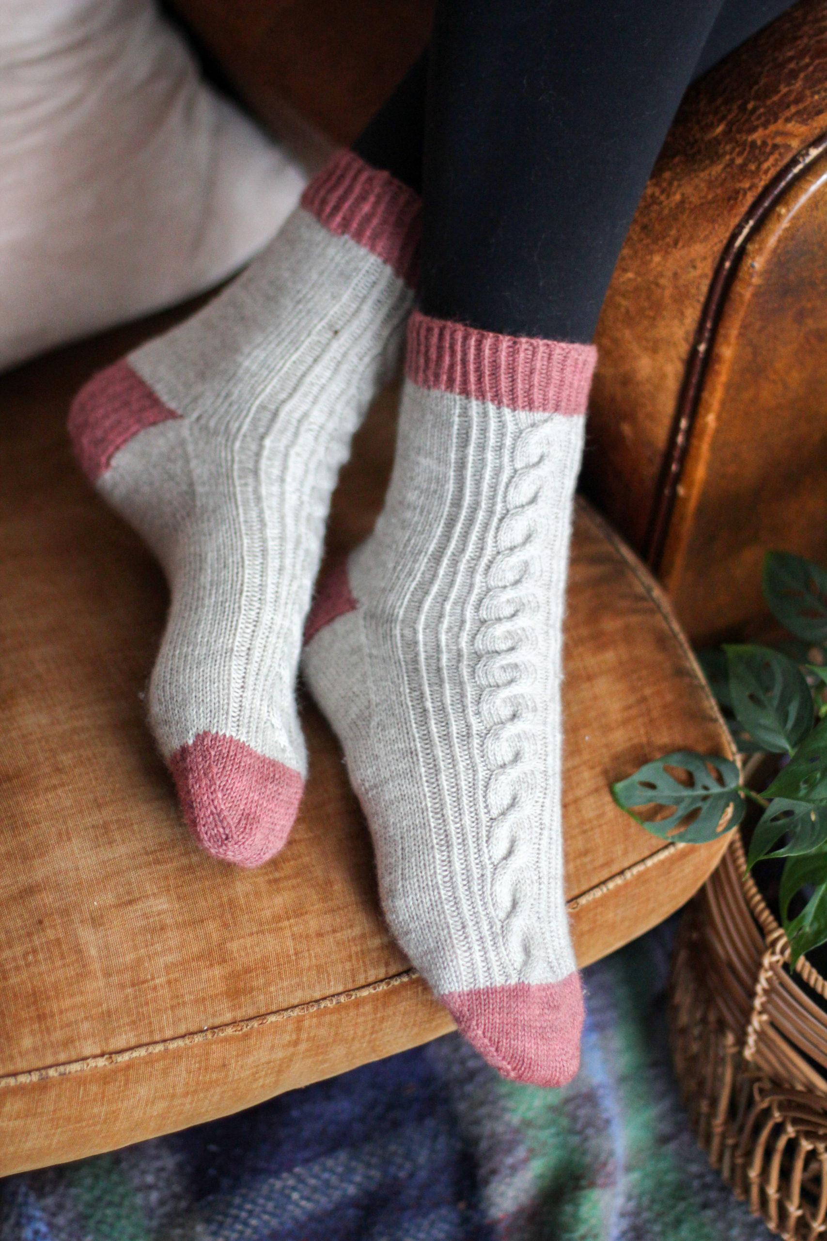the Cheering Socks, knit in white with pink contrast cuff, heel and toes. Knitting Pattern by Helen Stewart of Curious Handmade