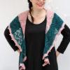 Delicate fine knit pink shawl with green stripe.