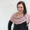 Delicate fine knit pink shawl.