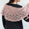 Delicate fine knit pink shawl with green stripe.
