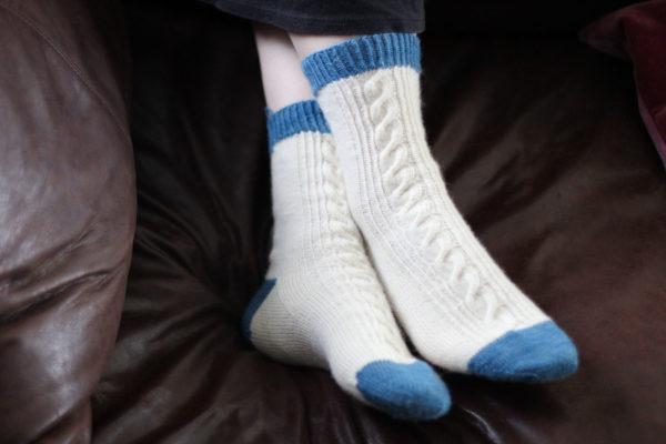 white socks with blue top, heel and toe patches