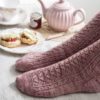 Cornish Cream Tea Socks have a panel of lace and texture down the front of the leg and foot with plain stockinette at the back.