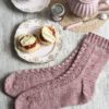 Cornish Cream Tea Socks have a panel of lace and texture down the front of the leg and foot with plain stockinette at the back.