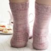 Cornish Cream Tea Socks have a panel of lace and texture down the front of the leg and foot with plain stockinette at the back.