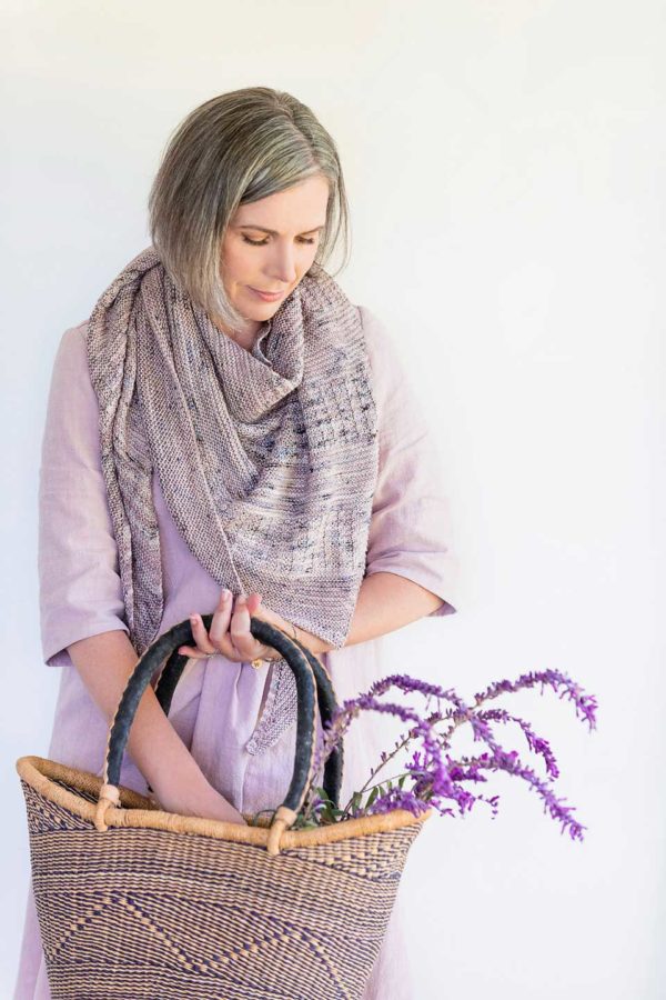 Purple Curling Mist Shawl on Helen. She's also carrying a wicker basket with a bunch of Lavender