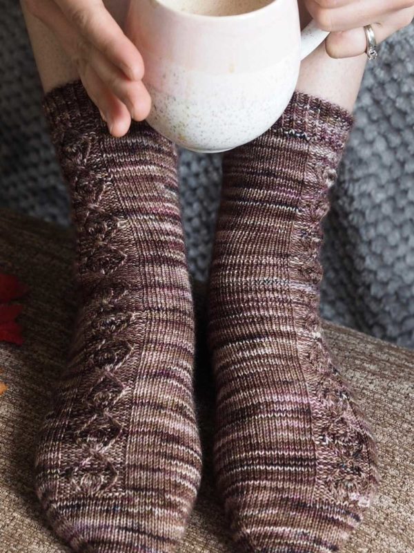 The Hazelnut Socks have a simple twisted stitches creates texture and interest.