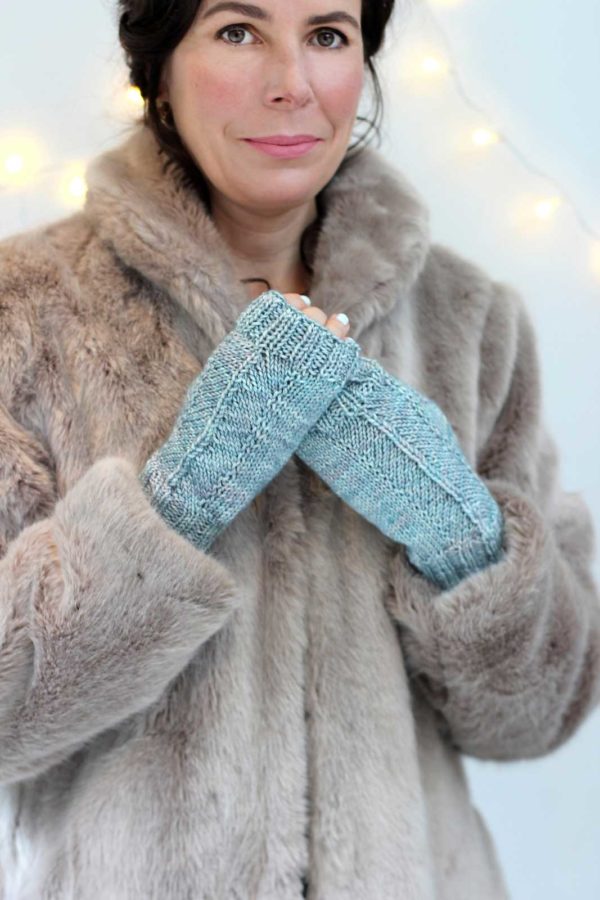 The How Quiet Mitts are fingerless ice blue mitts.