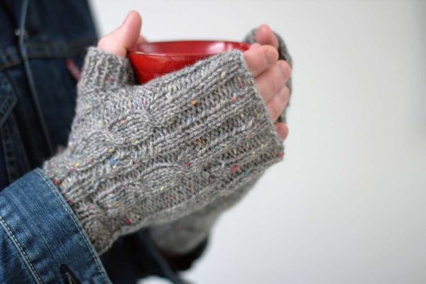 The Kindling Mitts are a beautiful grey, rustic yet classic, easy-to-knit fingerless gloves.