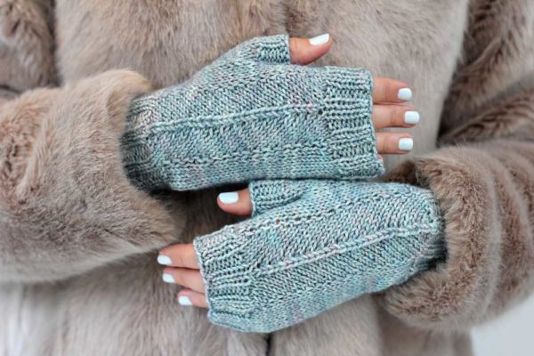 The How Quiet Mitts are fingerless ice blue mitts.