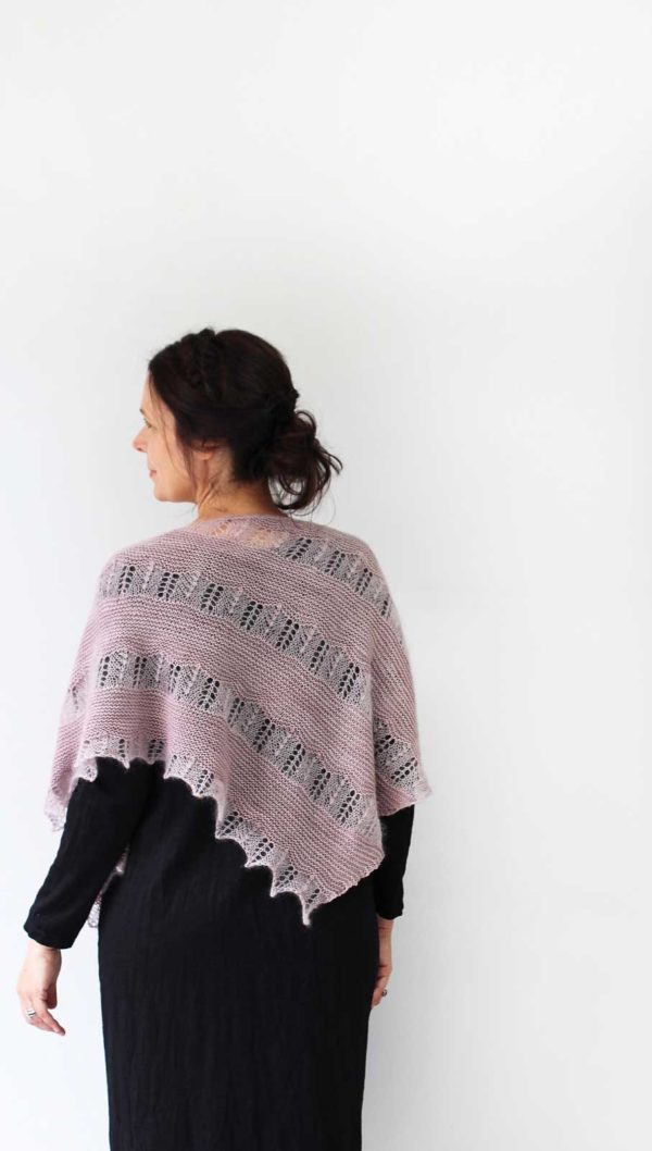 Learning to Cry is an asymmetrical triangle shawl has sections of gentle garter stitch in fingering weight are shot through with bands of lace weight mohair and silk yarn.