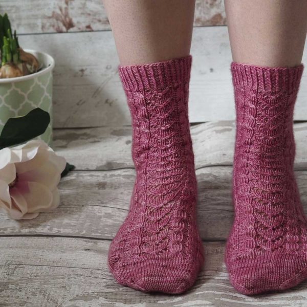 The Magnolia Socks are a plain red stockinette with a heel flap and gusset, and a round toe for a comfy fit.