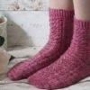 The Magnolia Socks are a plain red stockinette with a heel flap and gusset, and a round toe for a comfy fit.