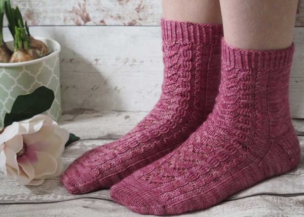 The Magnolia Socks are a plain red stockinette with a heel flap and gusset, and a round toe for a comfy fit.