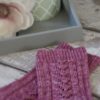 The Magnolia Socks are a plain red stockinette with a heel flap and gusset, and a round toe for a comfy fit.