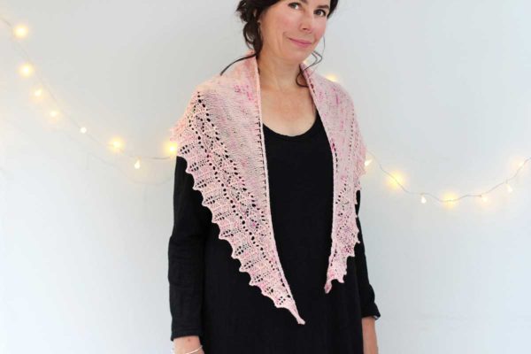 The Peace of Wild Things Shawl is a graceful crescent shape is easy to wear, and the little details of this shawl make a very special gift.
