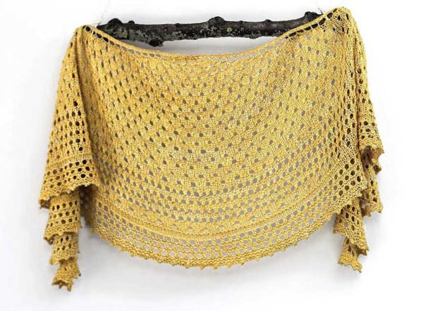 Pebble Beach Shawl is a light crescent shaped accessory, perfect for keeping off chilly sea breezes while at the beach.