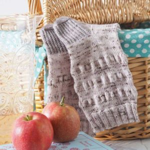 The Picnic Blanket Socks have a ruched stitch pattern, and the top down with a simple 2x2 rib cuff, and a gusset with a rounded toe.
