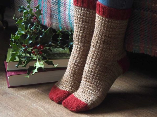 The Red Robin socks are knit from the top down and finished with a heel flap and gusset with contrasting cuffs, heels and toes - for fun!