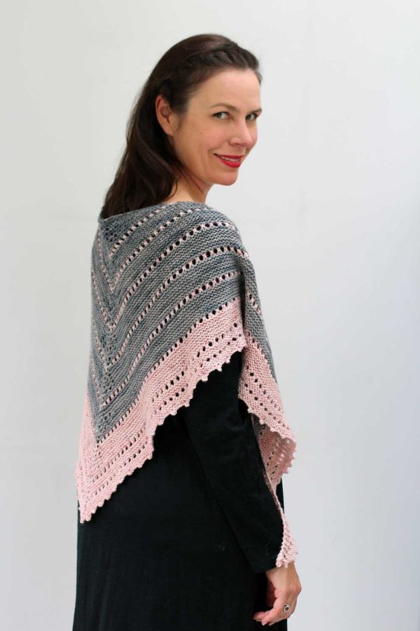 The Rune Shawl is full of subtle detail and secret features. Knit in two colours with a deceptively simple garter and eyelet pattern.