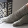 The Sailing School Socks feature a nautical side panel and a decorative stitches, and a heel flap and gusset with a wedge toe finish off.