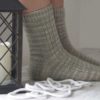 The Sailing School Socks feature a nautical side panel and a decorative stitches, and a heel flap and gusset with a wedge toe finish off.