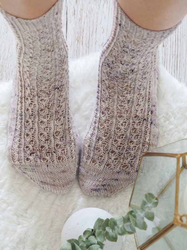 The Scribbly Gum Socks have a knit top-down, starting with a 1x1 rib cuff. A fun twisted stitch pattern and a slipped stitch heel.