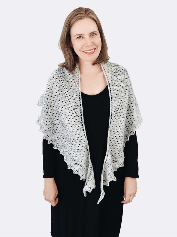 This two-skein Sea Gleam Shawl is a gentle crescent shape. It's big on texture, with broad garter, stockinette sections and a lace border.