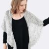 This two-skein Sea Gleam Shawl is a gentle crescent shape. It's big on texture, with broad garter, stockinette sections and a lace border.