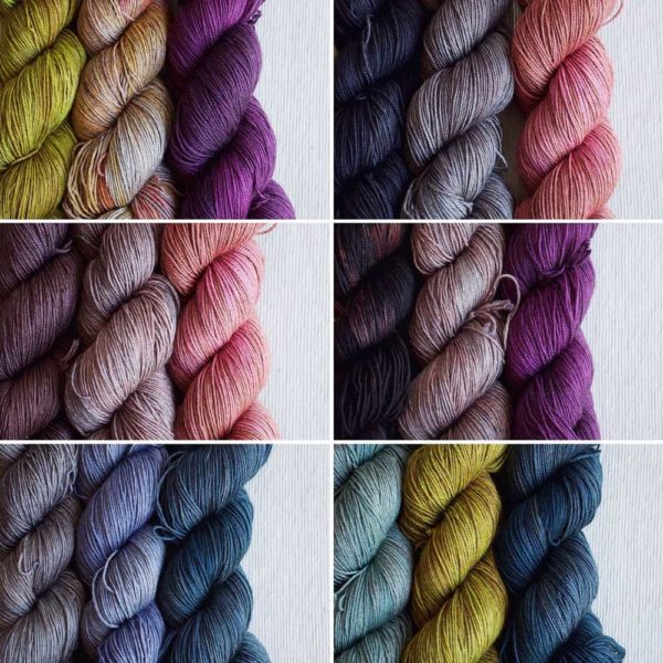 Multiple twisted yarns from yellow, and purple to pink, grey and greens and blues