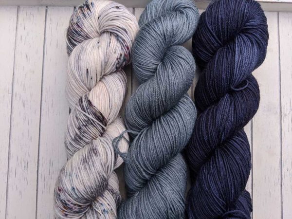 Twisted Yarns in white with flecks of blue, saturated sky blue and deep dark blue