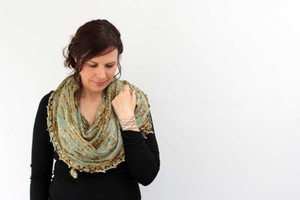 Magical, safe, and full of good fortune, the Talisman Shawl is a carefree crescent, inscribed with a simple star stitch.