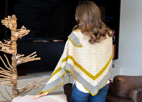 The three-colour triangle Tidings Shawl features big stripes of texture, with sections of ribbing and a beautiful, easy-to-memorise stitch pattern.