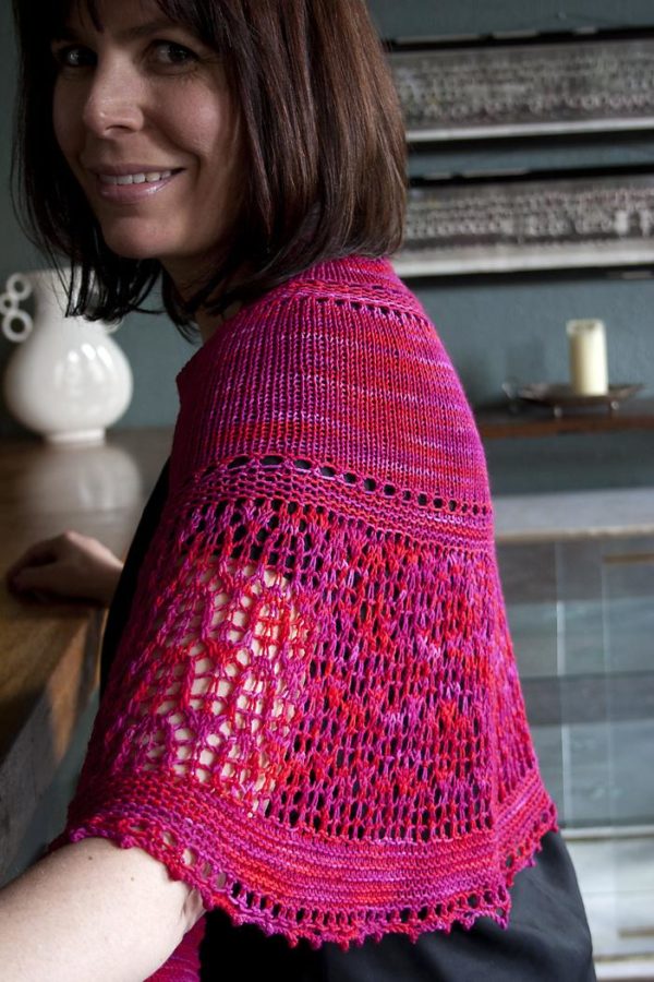 The Velvet Rose Shawl is a delicate yet seductive shawl in a semicircular shape, created using sock weight yarn.