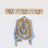 The Wild Bees Wrap is a three-colour rectangular wrap is a fun and engaging knit on a grand scale, with plenty of interest.