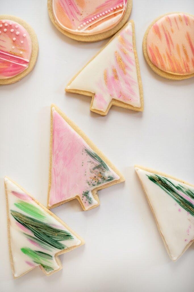 Iced sugar cookies frosted with pink, white, and green icing.